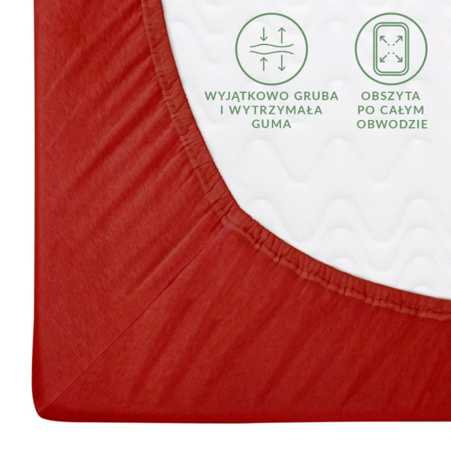 Prześcieradło jersey z gumką w kolorze czerwonym, rozmiar 160x200 cm, ukazane z boku. Widoczne detale: wytrzymała guma obszyta po obwodzie, faktura materiału oraz logo z informacjami o właściwościach. Tło proste, co podkreśla kolor produktu.