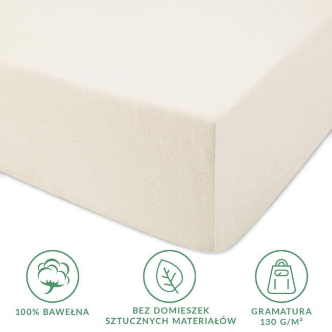 Prześcieradło jersey z gumką 70x140 w kolorze ecru, wykonane w 100% z bawełny, bez domieszek sztucznych materiałów, z gramaturą 130 g/m². Widoczny detal gumki, która zapewnia idealne dopasowanie. Ujęcie frontalne na gładkiej, jasnej powierzchni.