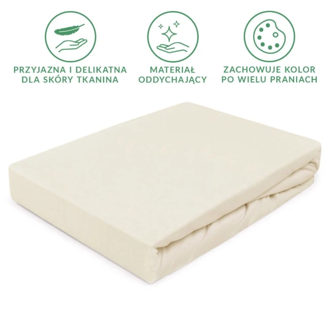 Prześcieradło jersey z gumką w kolorze ecru o wymiarach 90x200 cm, leżące na białym tle, o gładkiej, elastycznej strukturze materiału, z lekko zaokrąglonymi krawędziami. Widoczna gumka zapewniająca mocne trzymanie na materacu.