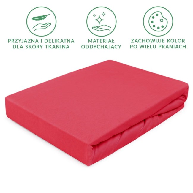 Prześcieradło jersey z gumką w kolorze koralowym, o wymiarach 40x90 cm, leżące na białym tle. Widoczna gładka, elastyczna tkanina dopasowująca się do materaca, z wyraźnie zakładanym brzegiem.