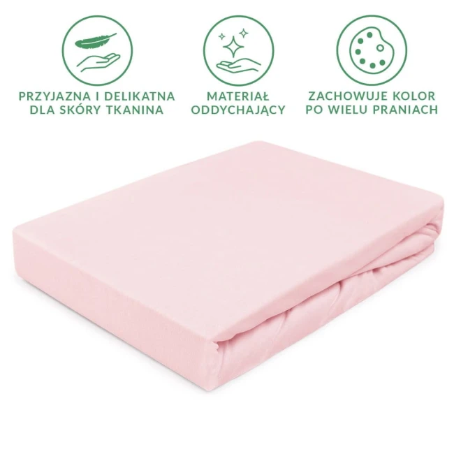 Prześcieradło Jersey z gumką w kolorze różu kwarcowego, leżące na białym tle. Materiał z lekką teksturą, elastyczny, dopasowujący się do materaca. Widoczne zaokrąglenia rogów oraz gumka gwarantująca stabilność. Wymiary 80x160 cm.