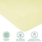 Prześcieradło frotte z gumką 120x200 w kolorze kremowym, leżące na płaskiej powierzchni. Widoczna faktura materiału, z informacjami o składzie (82% bawełna, 18% poliester) oraz wysokiej gramaturze 155 g/m². Proste tło.