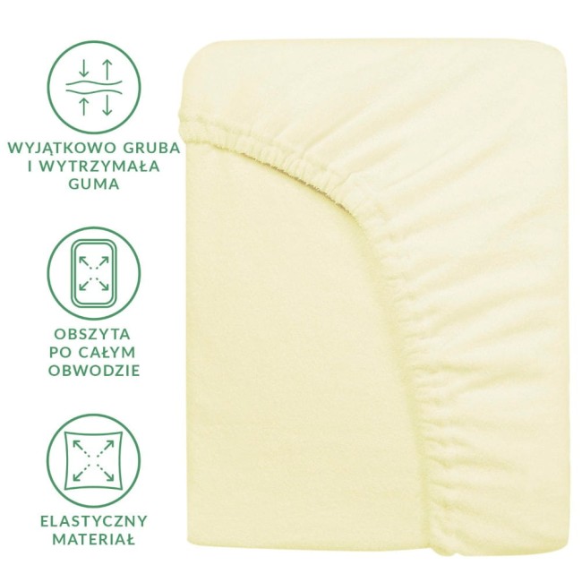 Prześcieradło frotte z gumką w kolorze kremowym, rozmiar 200x220 cm, z widocznymi detalami elastycznego materiału i grubej gumy, ułożone płasko na jednolitym tle. Widoczny jest obszyt po całym obwodzie oraz właściwości materiału.