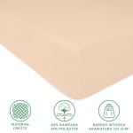 Prześcieradło frotte z gumką w kolorze róż perłowy, rozmiar 140x200 cm, wykonane z 82% bawełny i 18% poliestru. Widoczna faktura frotte oraz wzmocnione krawędzie.