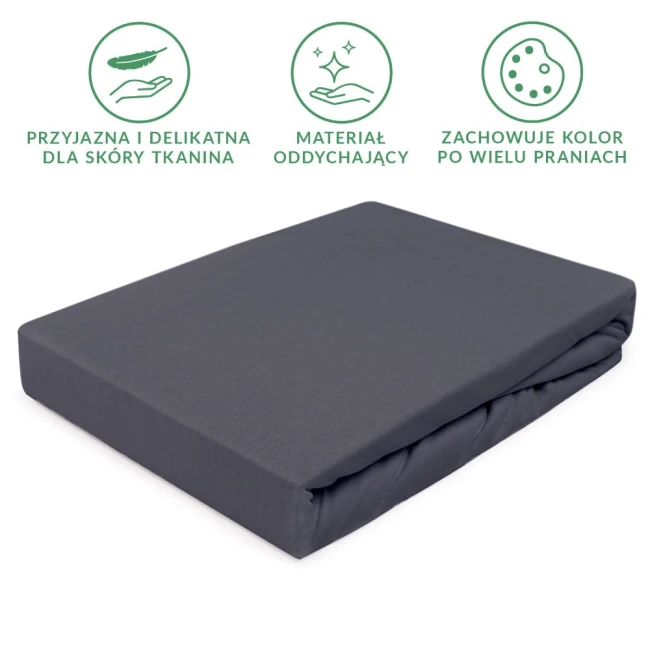 Prześcieradło jersey z gumką w kolorze antracytowym, o wymiarach 70x140 cm, w pozycji leżącej, na jednolitym tle. Materiał oddychający, przyjazny dla skóry, z gładką fakturą. Nie zawiera widocznych napisów ani logo.